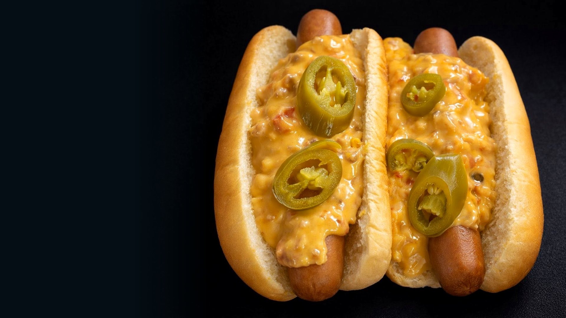 All-beef dogs under creamy Rotel queso at Unbothered Scoops